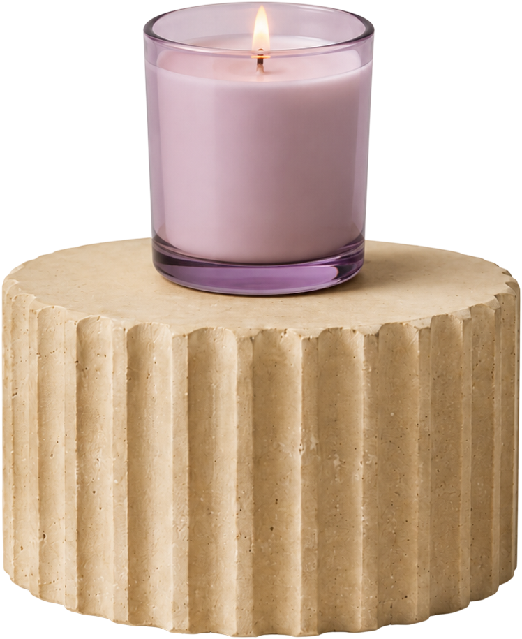 Lilac candle on a fluted stone podium